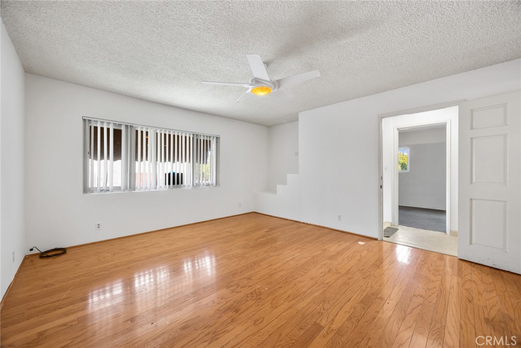 101 Hampden Terrace Alhambra, CA 91801 - Photo 6 of 46 a view of an empty room with wooden floor and a window