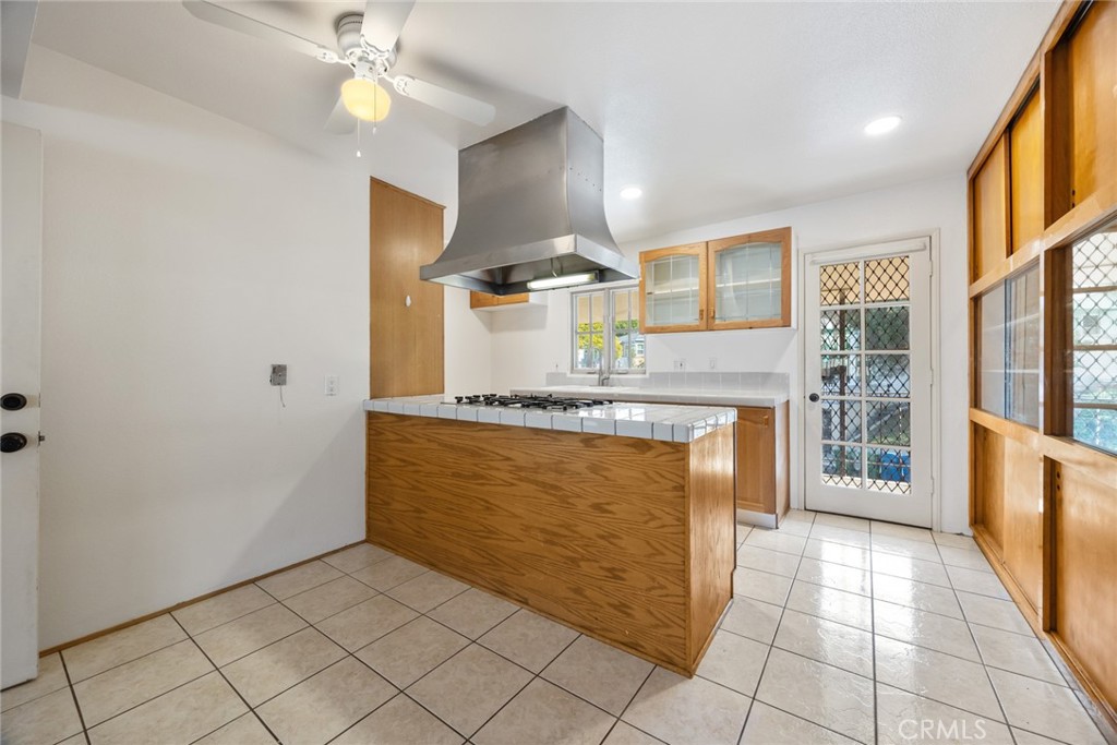 101 Hampden Terrace Alhambra, CA 91801 - Photo 10 of 46 a kitchen with stainless steel appliances granite countertop a refrigerator and a stove