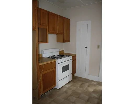 a kitchen with a stove and a microwave