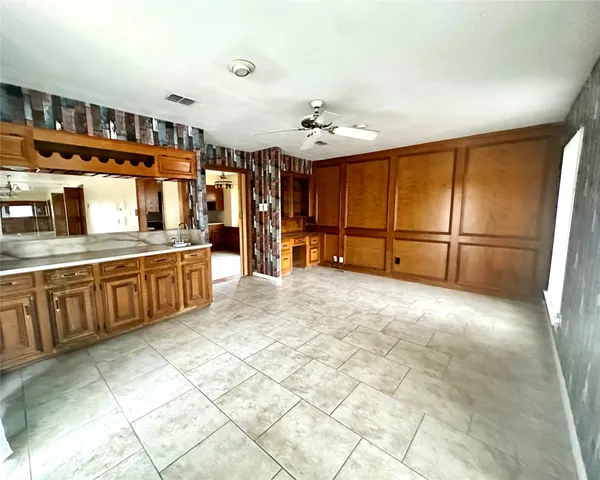 a view of a kitchen with furniture and cabinets