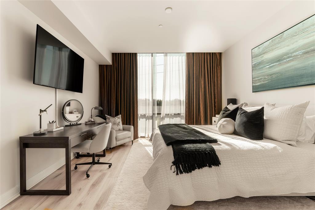 5656 North Central Expressway, Unit 207 Dallas, TX 75206 - Photo 17 of 34 a bedroom with bed chair and glass window