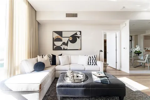 a living room with furniture and white walls