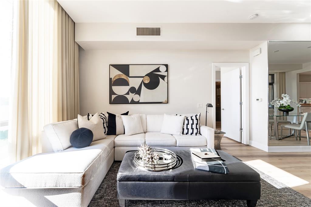 5656 North Central Expressway, Unit 207 Dallas, TX 75206 - Photo 2 of 34 a living room with furniture and white walls