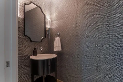 an entryway to room with wooden floor