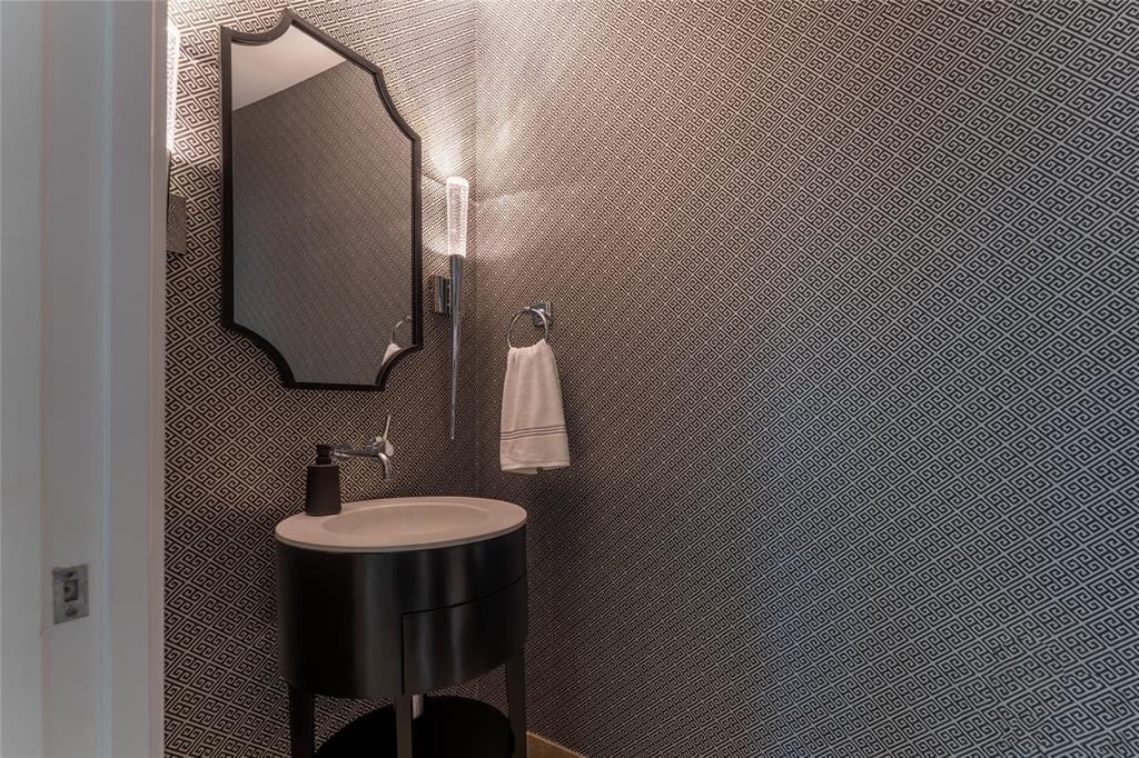 5656 North Central Expressway, Unit 207 Dallas, TX 75206 - Photo 23 of 34 a bathroom with a sink and a mirror