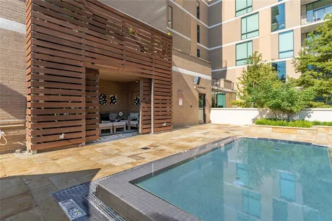 a view of a patio with table and chairs and potted plants