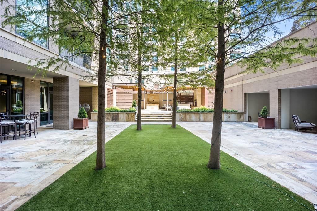 5656 North Central Expressway, Unit 207 Dallas, TX 75206 - Photo 30 of 34 a view of a house with backyard and a tree