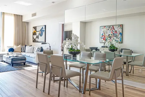 a view of a dining room with furniture window and wooden floor