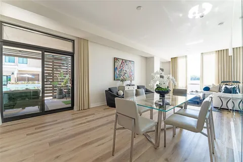 a view of a livingroom with furniture window and wooden floor