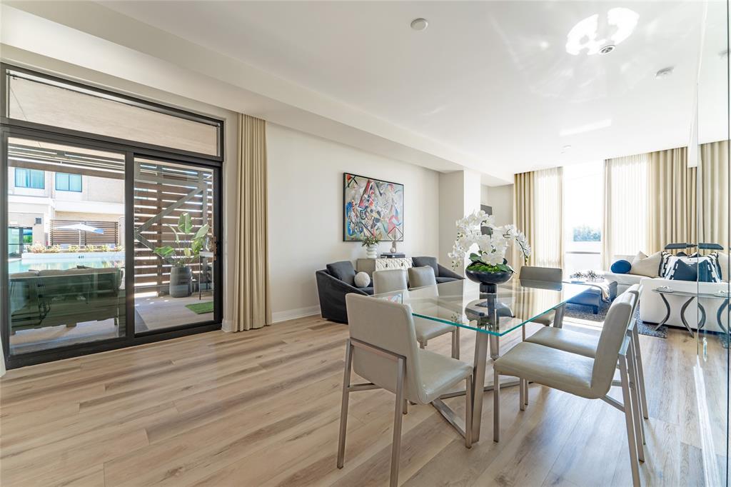 5656 North Central Expressway, Unit 207 Dallas, TX 75206 - Photo 5 of 34 a view of a livingroom with furniture window and wooden floor