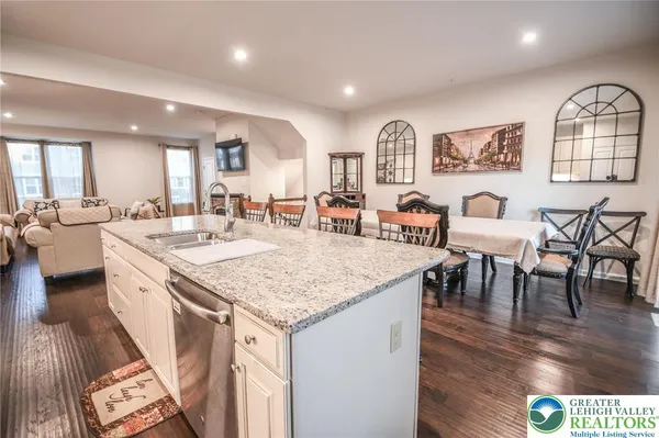 a view of center island dining table and chairs