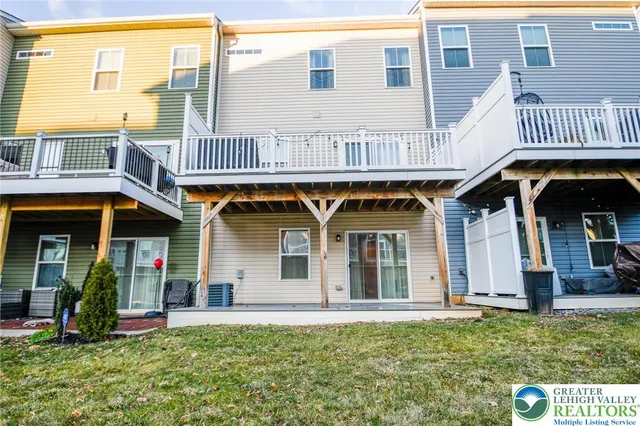 a view of a porch with wooden floor and furniture