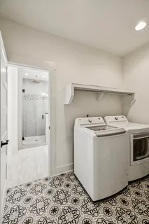 a bathroom with sinks granite vanity and a granite countertop mirror