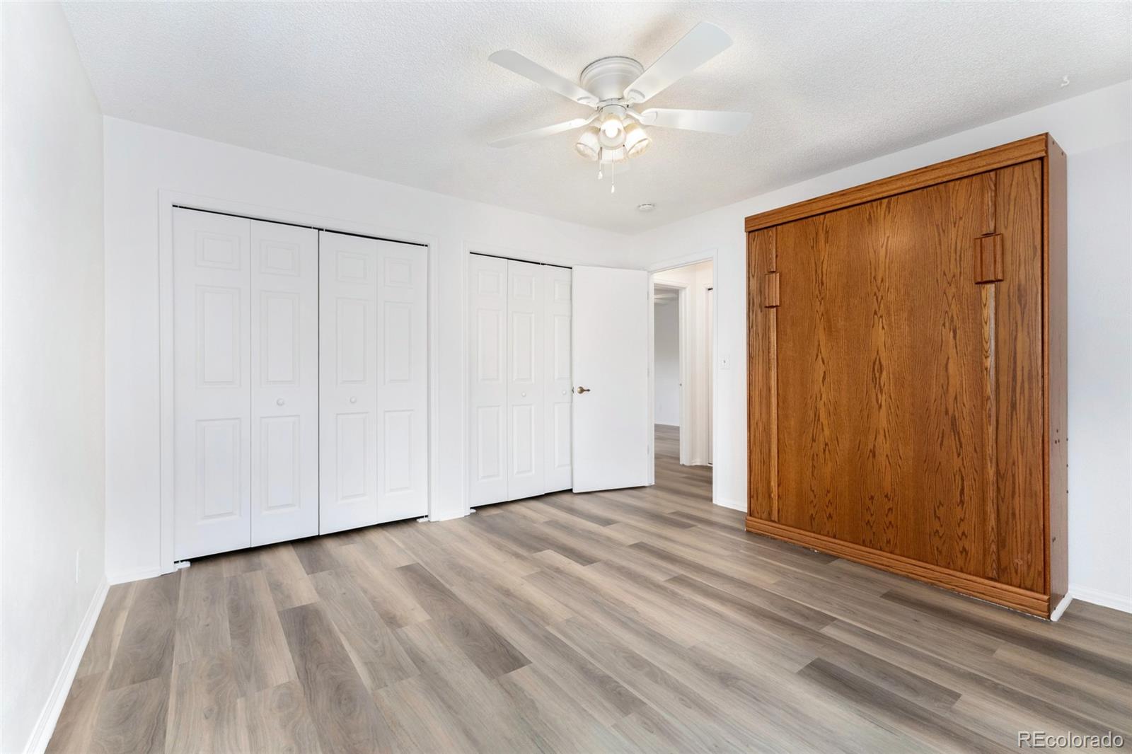 8417 Everett Way, Unit E Arvada, CO 80005 - Photo 14 of 36 a view of an empty room with a window