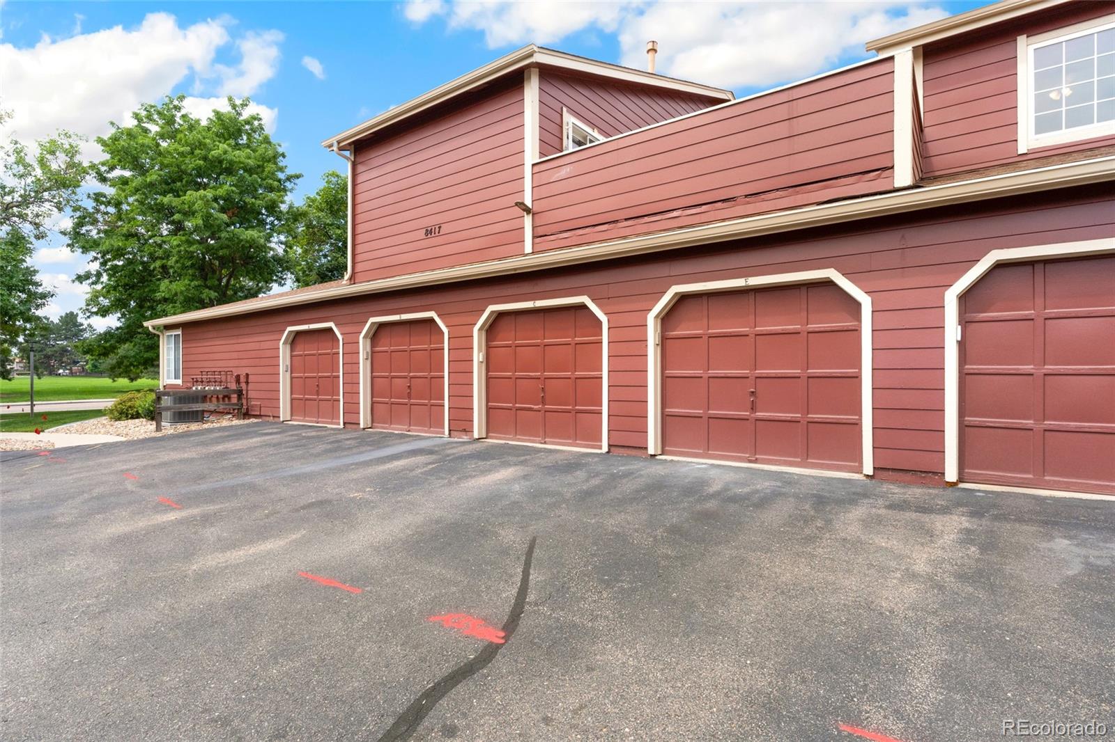 8417 Everett Way, Unit E Arvada, CO 80005 - Photo 27 of 36 a view of a house with a garage and yard