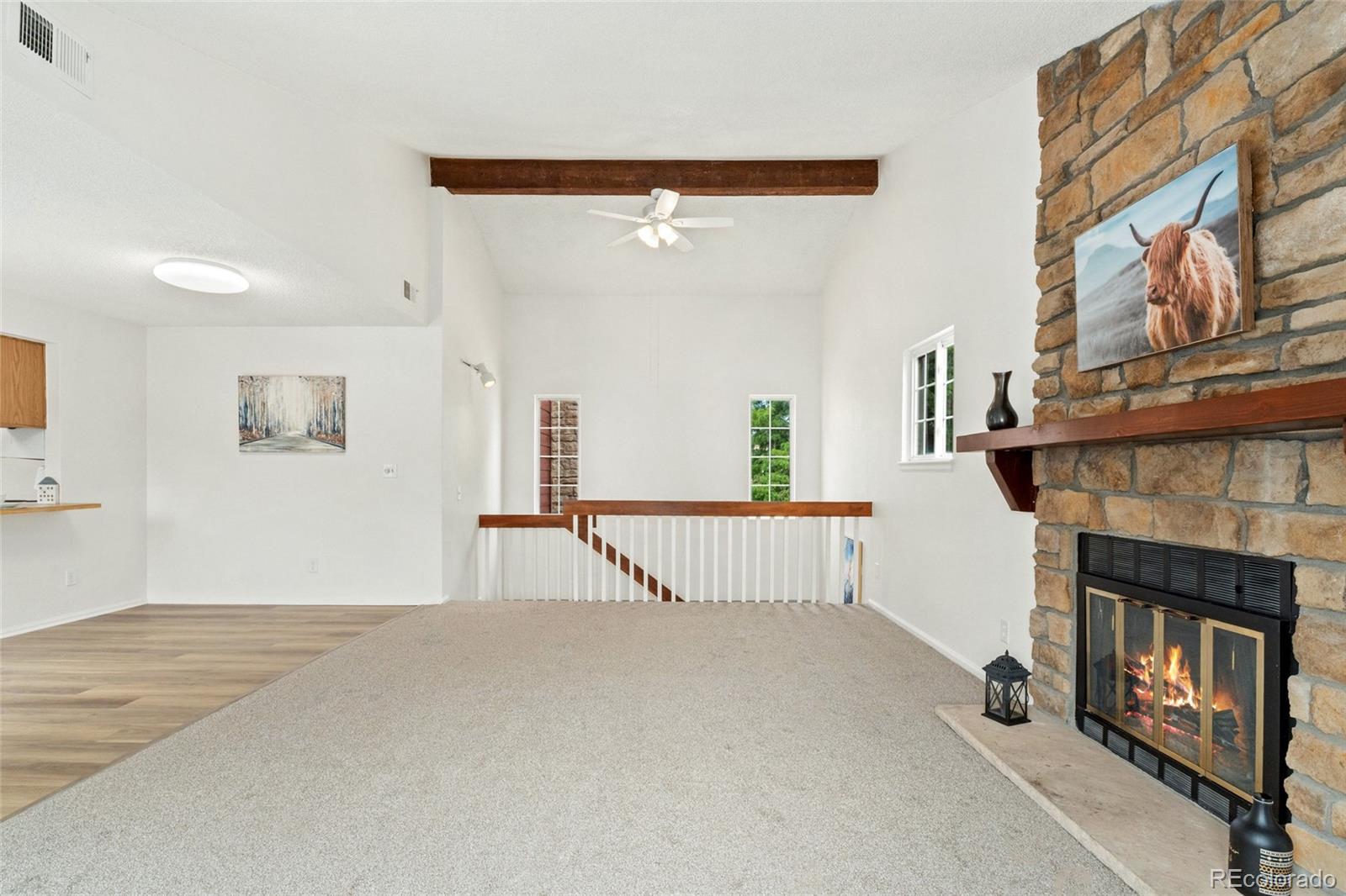 8417 Everett Way, Unit E Arvada, CO 80005 - Photo 4 of 36 a view of a livingroom with fireplace and furniture