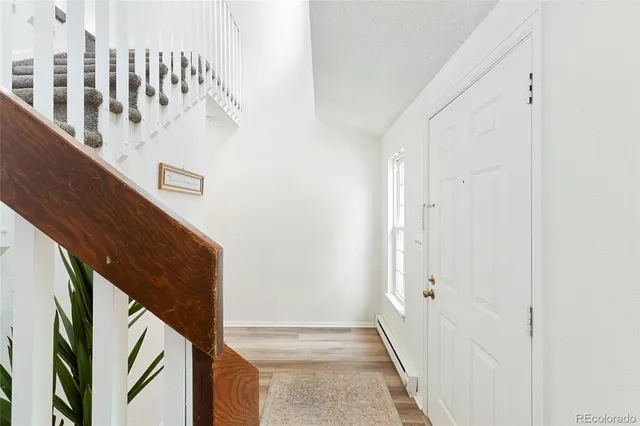 a view of livingroom with hardwood floor and ceiling fan