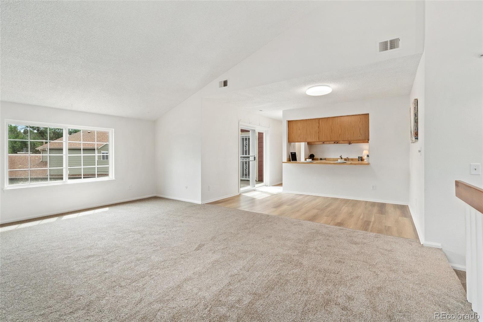 8417 Everett Way, Unit E Arvada, CO 80005 - Photo 8 of 36 a view of a livingroom with furniture and window