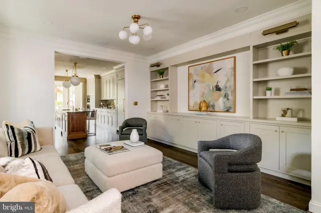 a living room with furniture and a painting