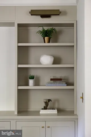 a shelf with cup and plates