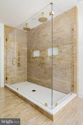a bathroom with a bathtub and shower