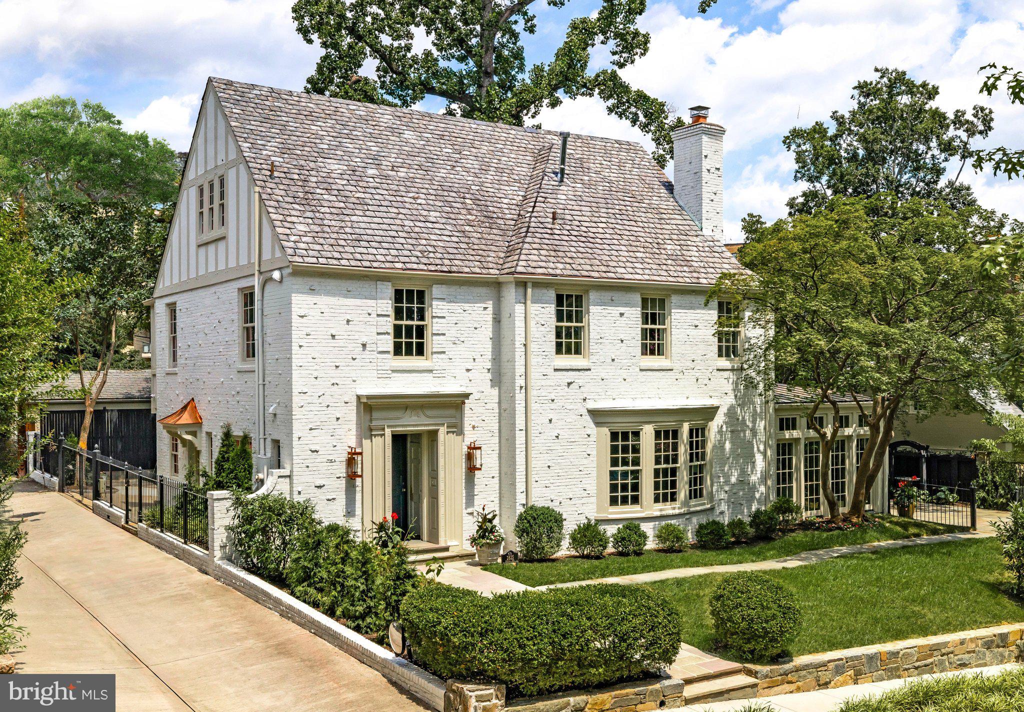 2825 McGill Terrace Northwest Washington, DC 20008 - Photo 3 of 50 a front view of a house with a yard