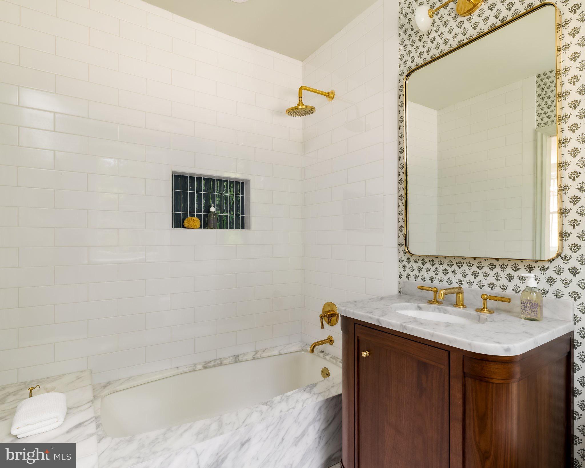 2825 McGill Terrace Northwest Washington, DC 20008 - Photo 36 of 50 a bathroom with a sink and a mirror