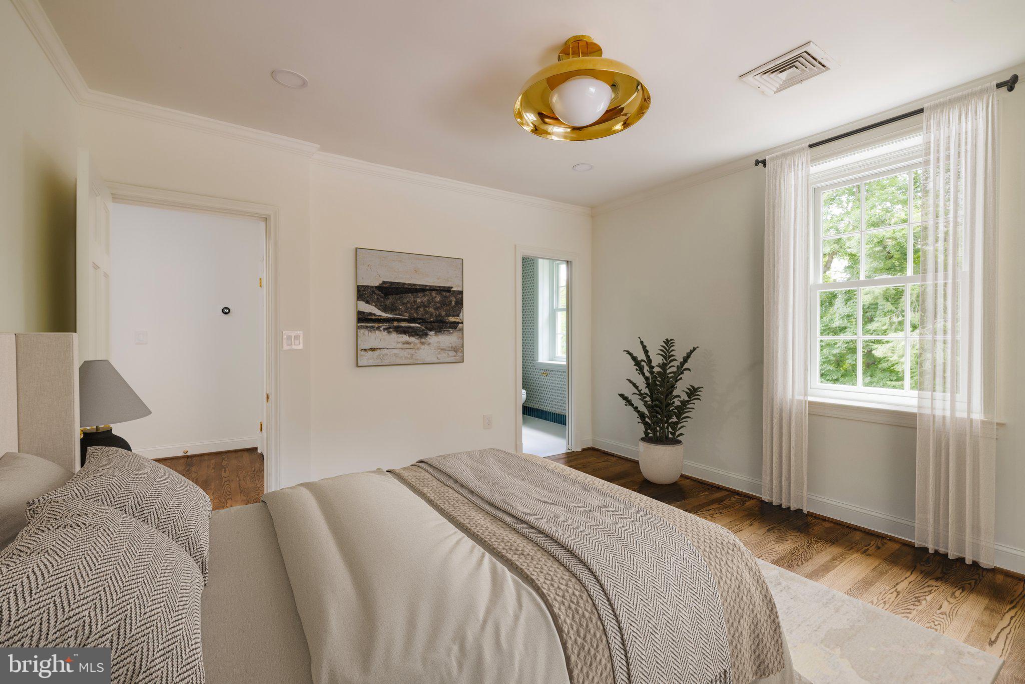 2825 McGill Terrace Northwest Washington, DC 20008 - Photo 37 of 50 a bedroom with a bed and window