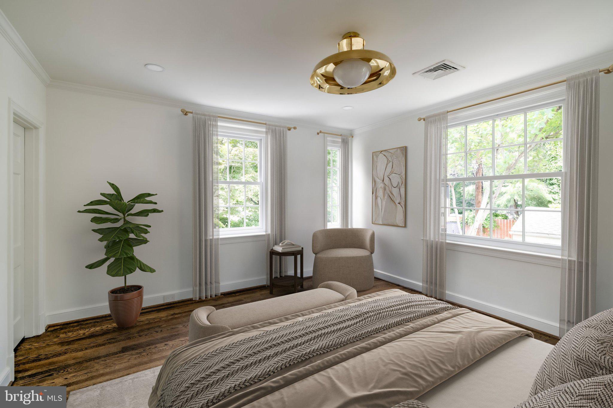 2825 McGill Terrace Northwest Washington, DC 20008 - Photo 40 of 50 a bedroom with a bed and a potted plant