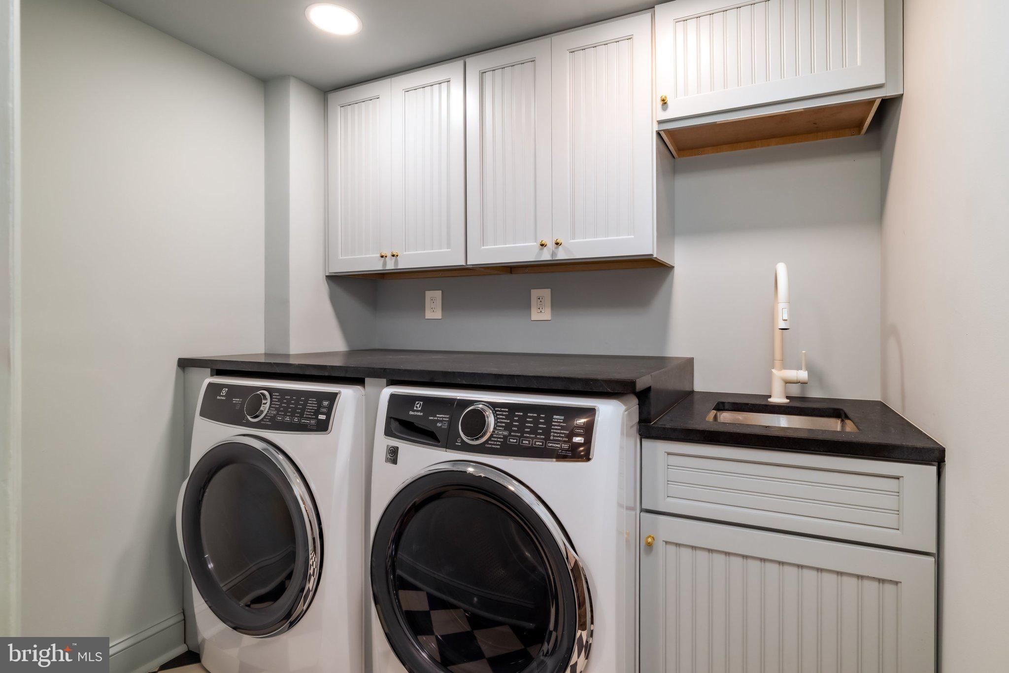 2825 McGill Terrace Northwest Washington, DC 20008 - Photo 45 of 50 a utility room with sink dryer and washer