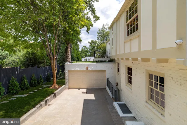 a view of a white house with a outdoor space