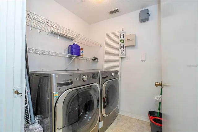 a view of a kitchen with a dishwasher and a window
