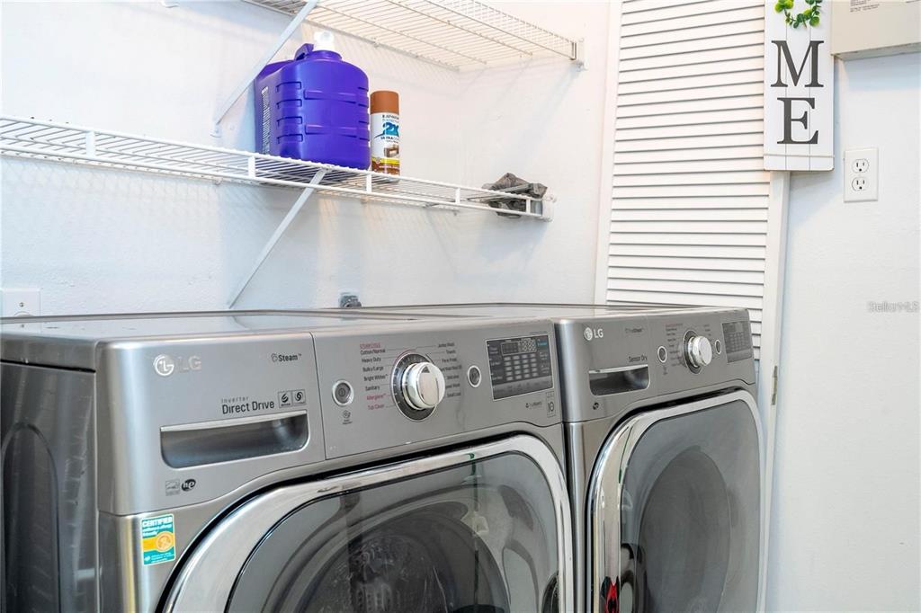 5572 Metrowest Boulevard, Unit 309 Orlando, FL 32811 - Photo 26 of 66 a utility room with dryer and washer