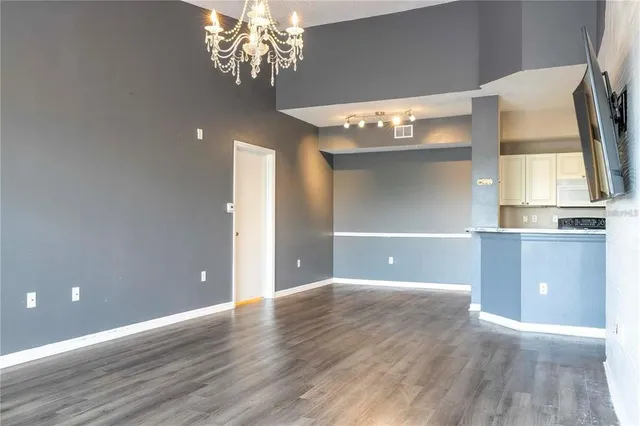 an aerial view of a house with outdoor space and a lake view