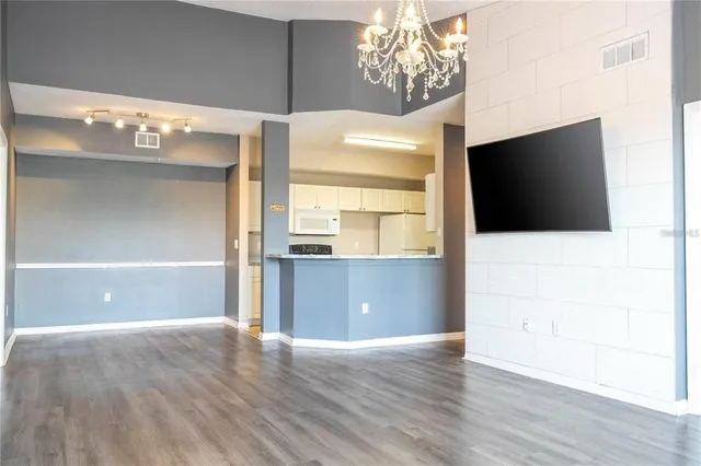 an aerial view of a house with a swimming pool