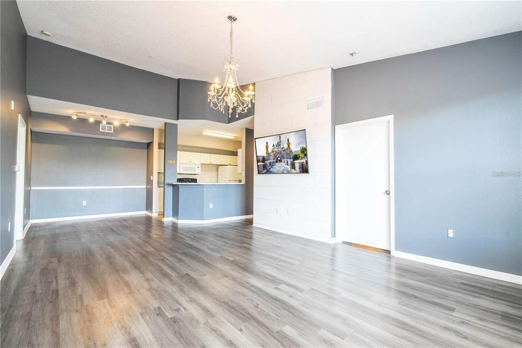 5572 Metrowest Boulevard, Unit 309 Orlando, FL 32811 - Photo 39 of 66 a view of empty room with wooden floor
