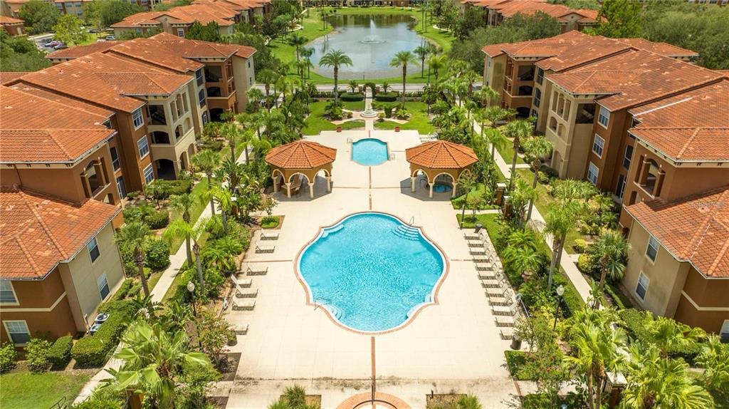 5572 Metrowest Boulevard, Unit 309 Orlando, FL 32811 - Photo 47 of 66 an aerial view of a house with a swimming pool