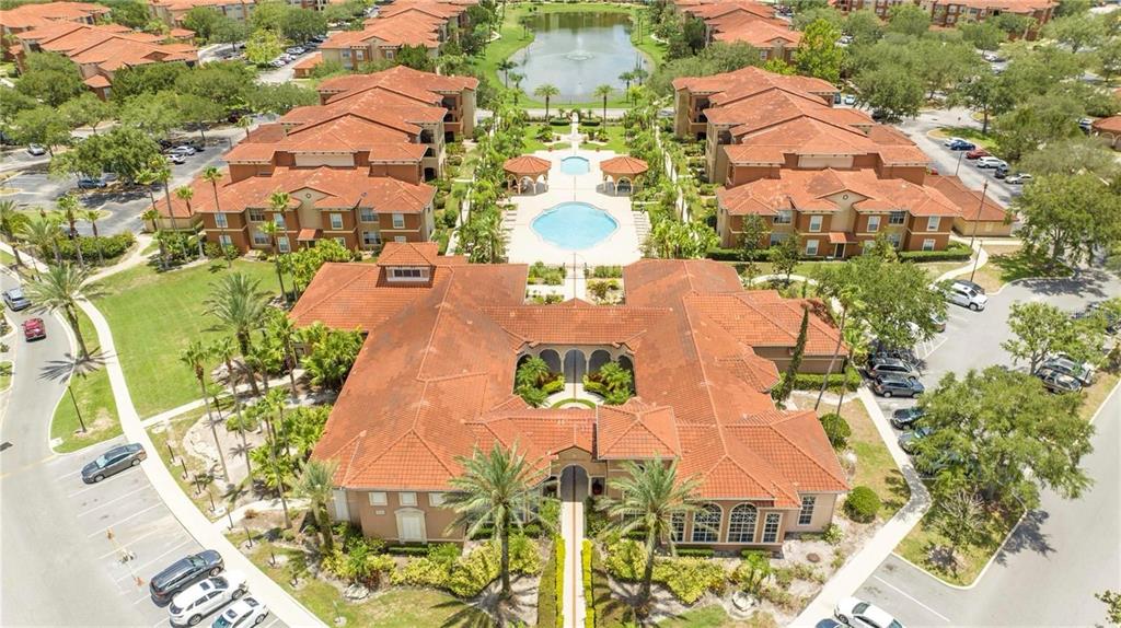 5572 Metrowest Boulevard, Unit 309 Orlando, FL 32811 - Photo 49 of 66 an aerial view of residential houses with outdoor space