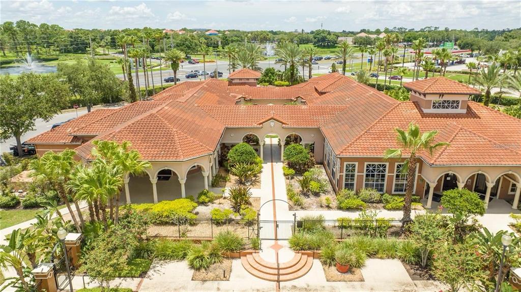 5572 Metrowest Boulevard, Unit 309 Orlando, FL 32811 - Photo 54 of 66 a balcony with table and chairs
