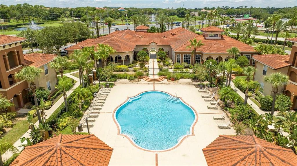 5572 Metrowest Boulevard, Unit 309 Orlando, FL 32811 - Photo 55 of 66 an aerial view of residential houses with outdoor space and river