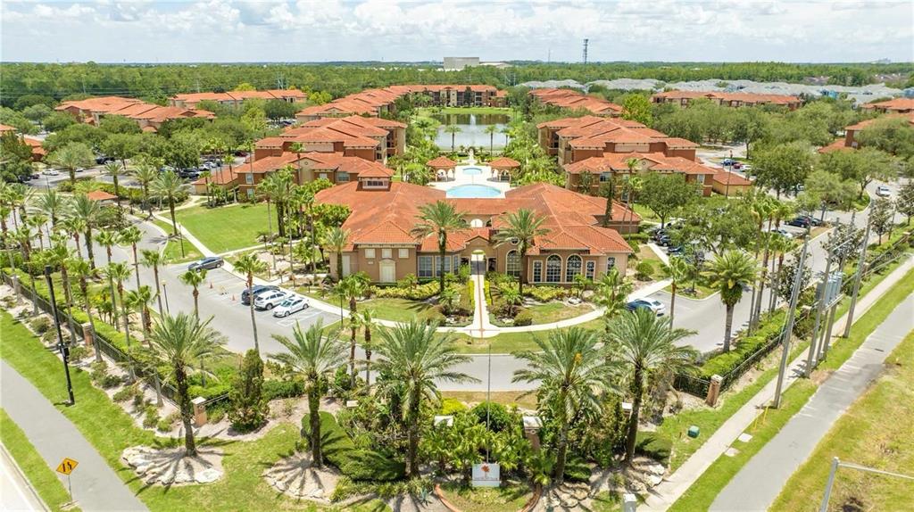 5572 Metrowest Boulevard, Unit 309 Orlando, FL 32811 - Photo 56 of 66 an aerial view of residential houses with outdoor space and trees