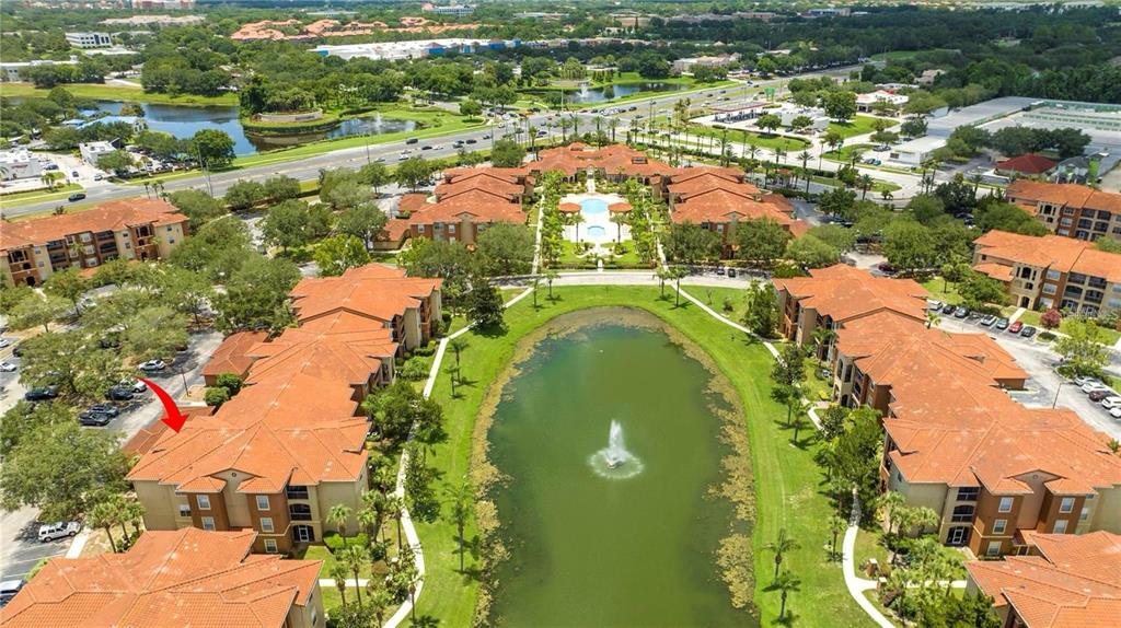 5572 Metrowest Boulevard, Unit 309 Orlando, FL 32811 - Photo 61 of 66 an aerial view of residential houses with outdoor space and swimming pool