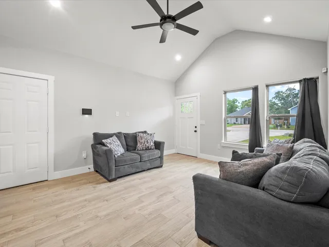 a living room with furniture and a large window