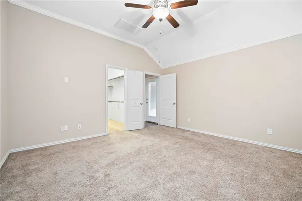 a view of an empty room with a cabinet