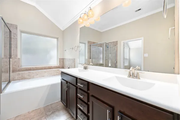 a bathroom with a granite countertop sink mirror and a bathtub