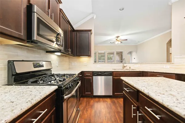 a kitchen with a stove and a sink