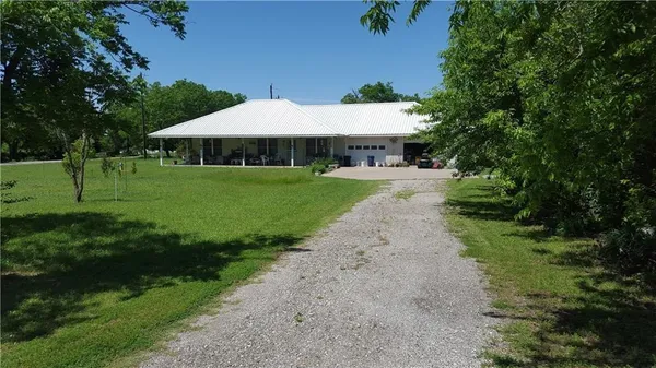 a view of a garden with an outdoor space