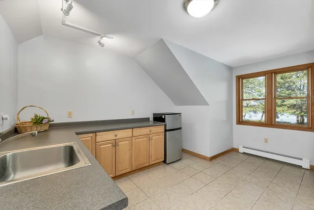 a kitchen that has a sink and a stove