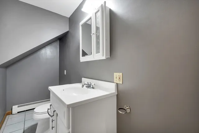 a bathroom with a sink and mirror