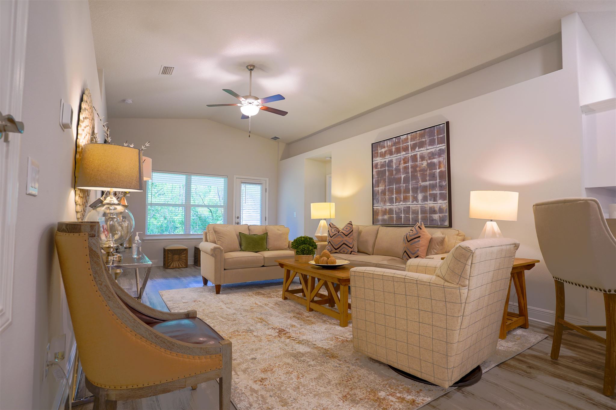 1813 Leigh Loop Cantonment, FL 32533 - Photo 4 of 15 a living room with furniture a fireplace and a large window